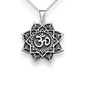 Chunky silver oxidised mandala flower pendant with the OM symbol in the centre of the flower. The pendant is on a simple silver chain.