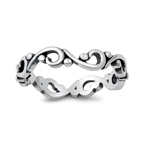 Silver bohemian ring with an oxidised finish. The band of the ring is created from a swirl like design and complemented with small silver dot details.  