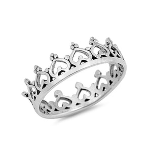 Chunky silver ring with a band made of hearts. The bottom of each heart  is detailed with three dots positioned into a triangle.