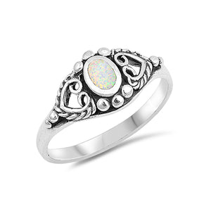 Pretty silver bohemian ring with an oxidised finish. In the centre of the ring is a white opal stone which sits between two sideways positioned hearts. 