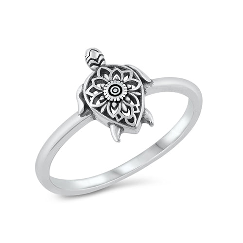 Pretty silver turtle ring with an oxidised finish. The back of the turtle is decorated with an intricate cut out flower design.