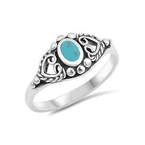  Pretty silver bohemian ring with an oxidised finish. In the centre of the ring is a simulated turquoise stone which sits between two sideways positioned hearts.