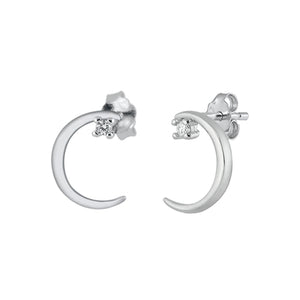 Delicate silver crescent moon stud earrings embellished with a dainty clear cubic zirconia stone under the top of the crescent.