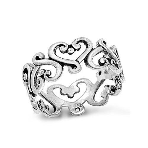  Chunky silver bohemian Bali ring. The band of the ring is comprised of interconnecting cut out heart shaped swirls with a small silver dot detail in the centre of each heart. 