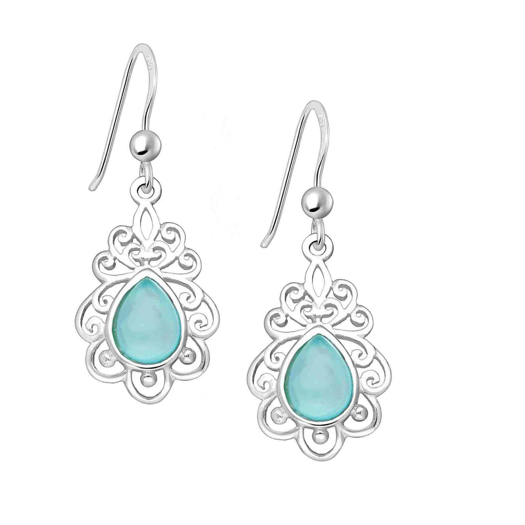 Pretty and delicate silver bohemian drop earrings embellished with pear cut aqua chalcedony stones. An intricate cut out swirl design surrounds each stone. 