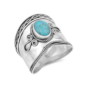 Chunky silver bohemian Bali ring embellished with a turquoise stone and detailed with silver rope and swirl designs.